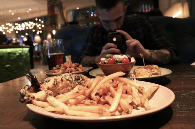 Famous roast chicken with peri peri fries at Nando's Toronto.