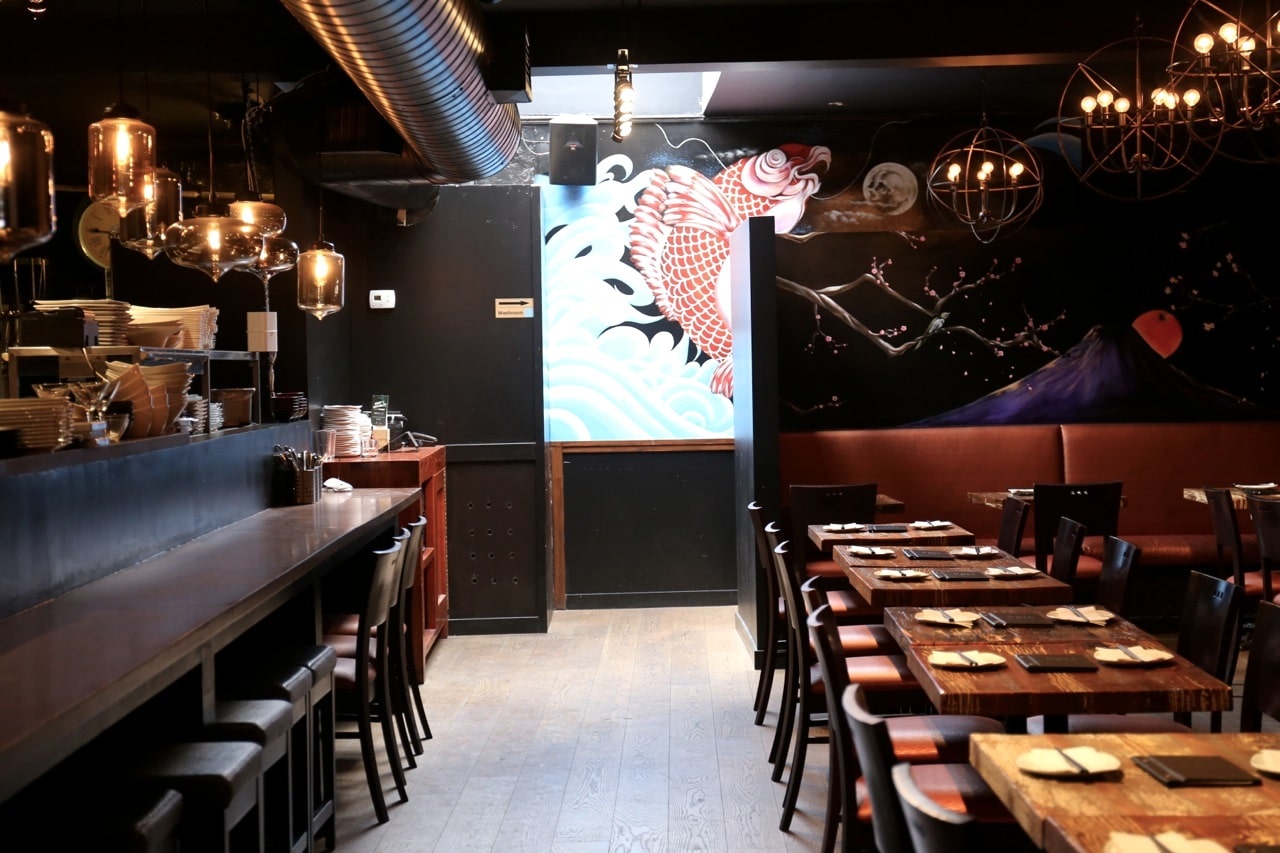 Koi fish decorate the dining room at Hapa Izakaya Toronto.