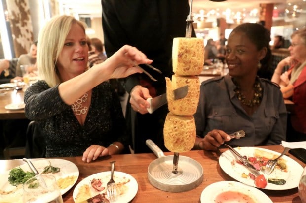 Guests are given tongs to grab their sliced BBQ.