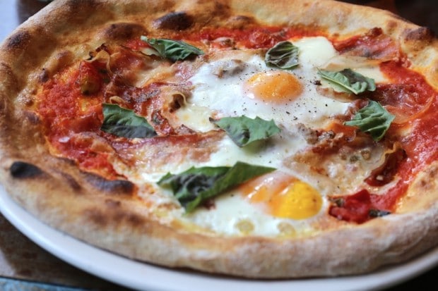 Breakfast pizza at Taverna Mercatto Italian restaurant in Toronto.