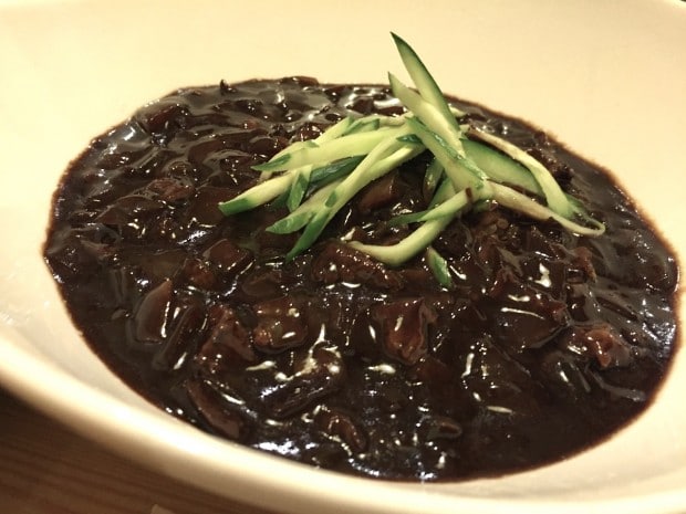 Jajangmyeon is a popular Korean dish prepared with black bean sauce, pork and noodles.