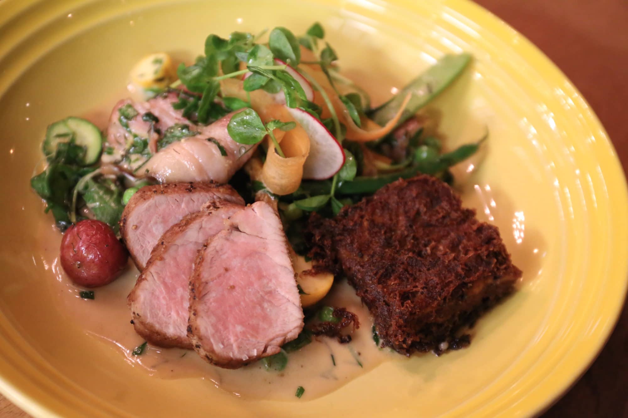 Ayden Saskatoon: Trio of Pork with local carrots, peas, rainbow chard, a la creme