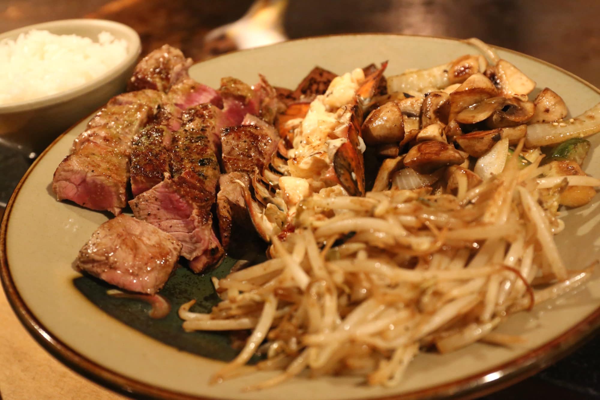 Chateaubriand steak with lobster tail, hibachi grilled onion, zucchini & mushrooms at Benihana 