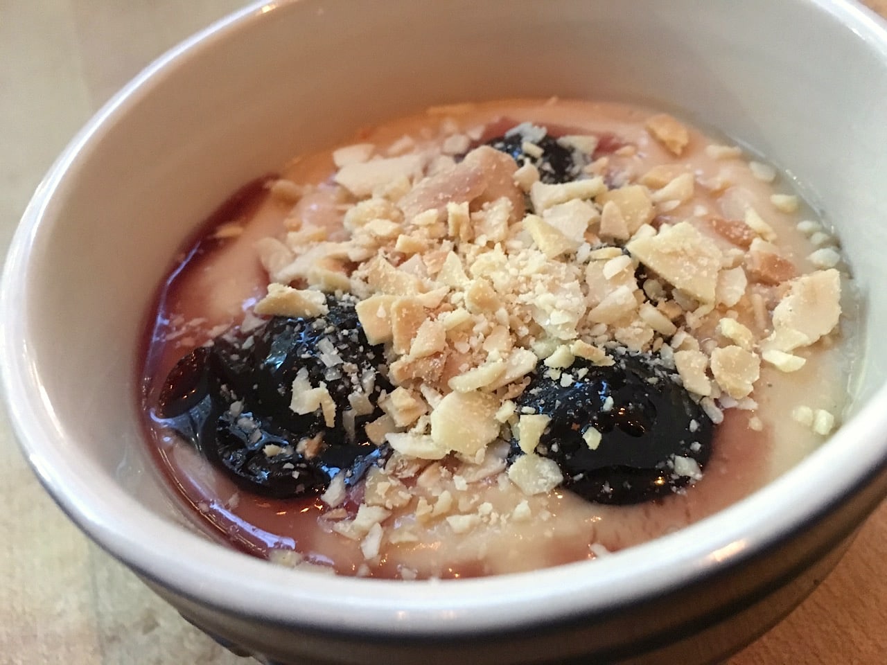 Finish your feast with Caramel Budino featuring slivered almonds, amerino cherries