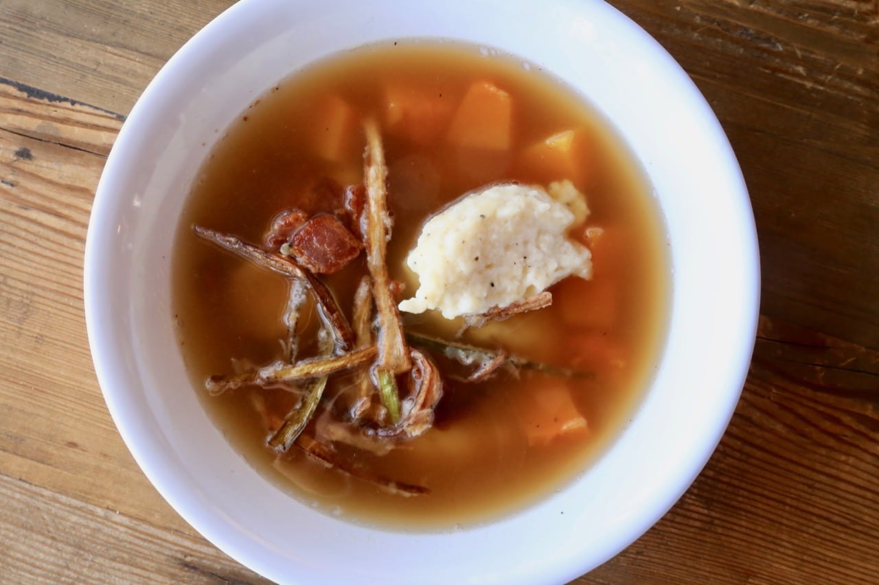 Italian Dumplings floating in a leek, bacon and squash soup.