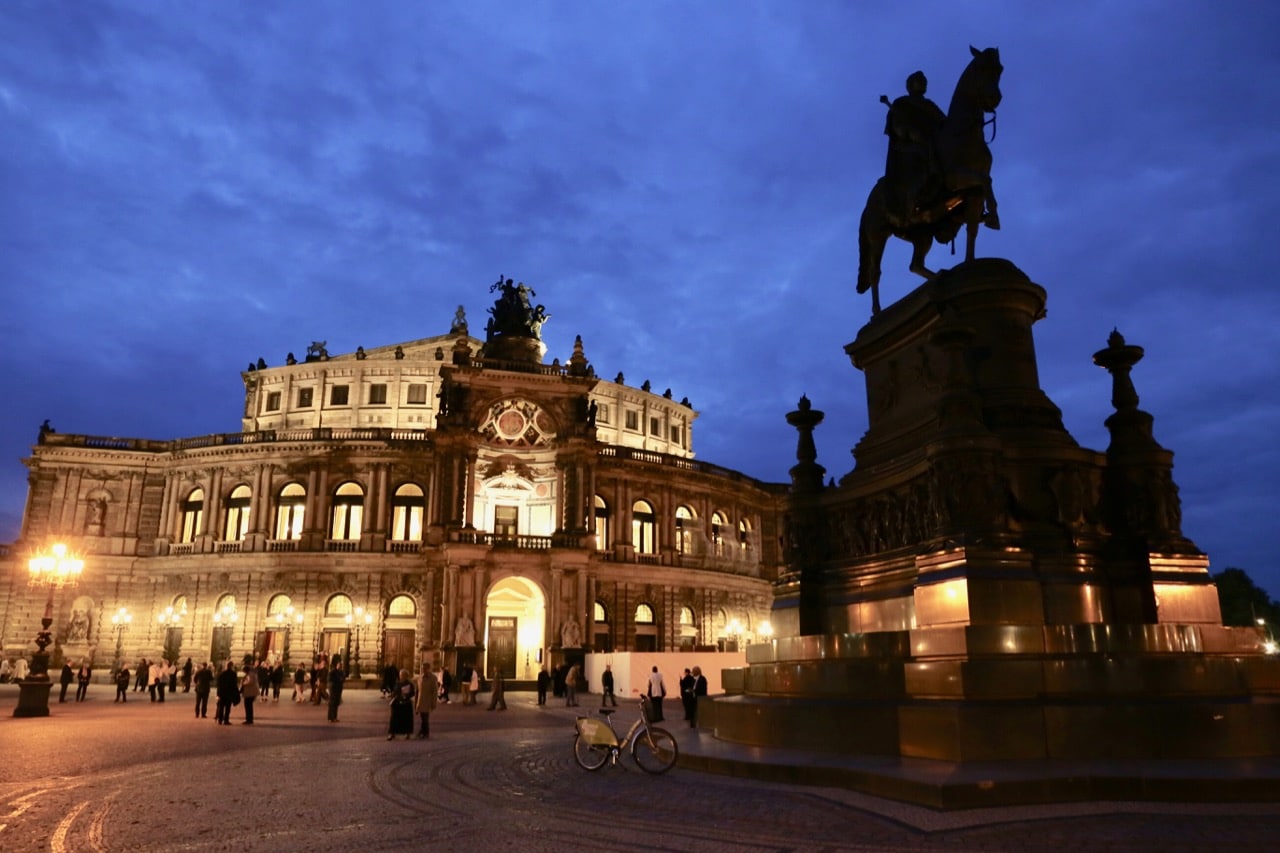 Enjoy a romantic walk at night by Semperoper, Dresden's opera house.