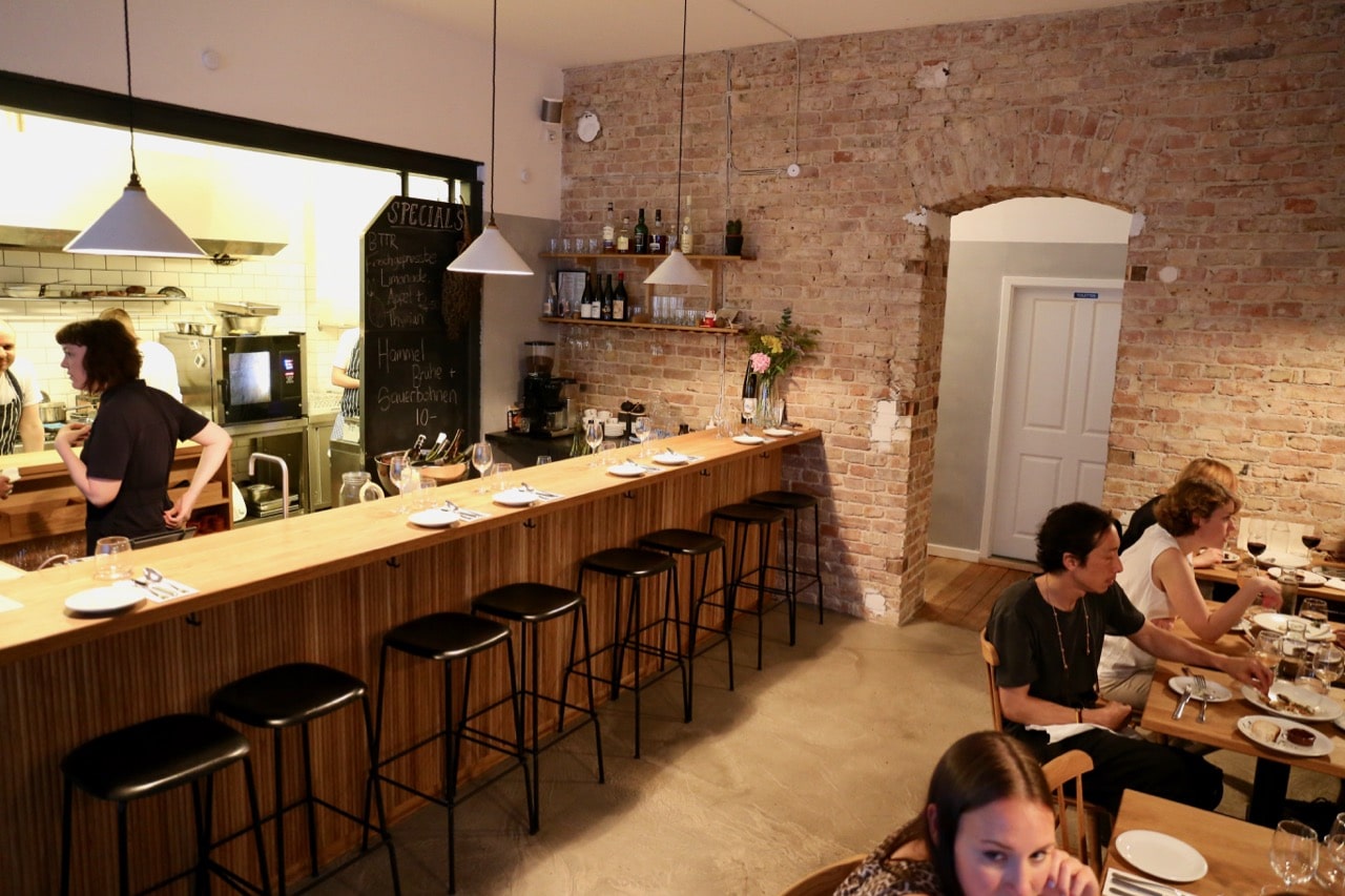 Barra Restaurant offers fine dining with an open kitchen view. 