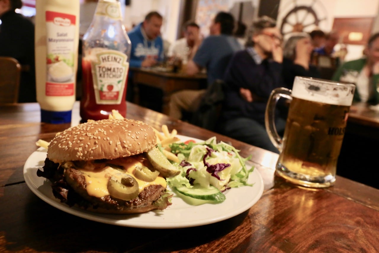 Join locals for a hamburger feast in Hamburg at Frau Moller restaurant.