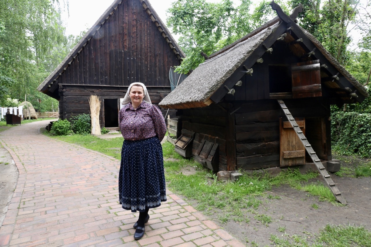 Staff welcome guests in local folk fashions at Freilandmuseum Lehde.