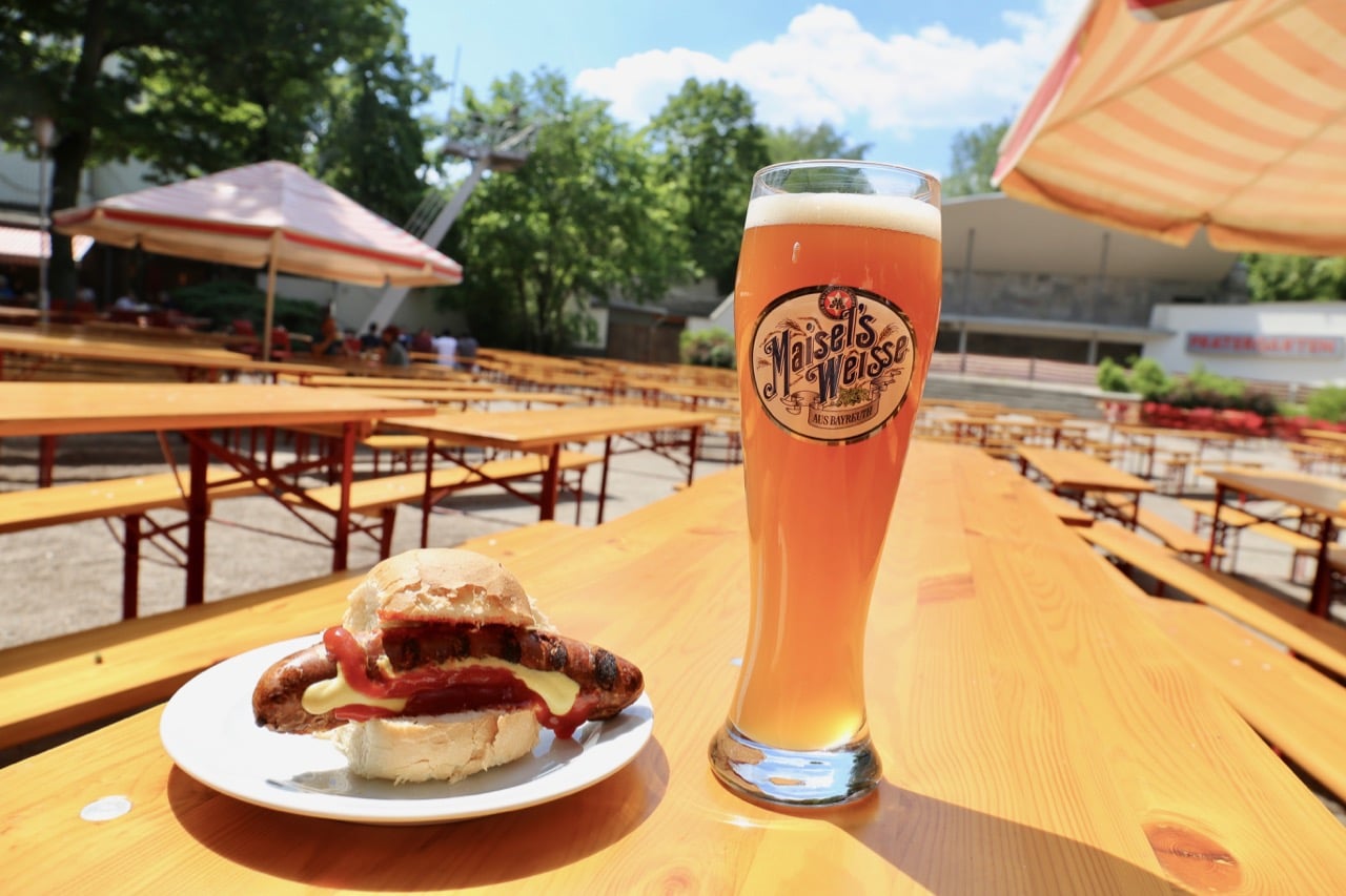 Enjoy an al fresco Berlin food feast featuring sausages and beer at Prater Garden.