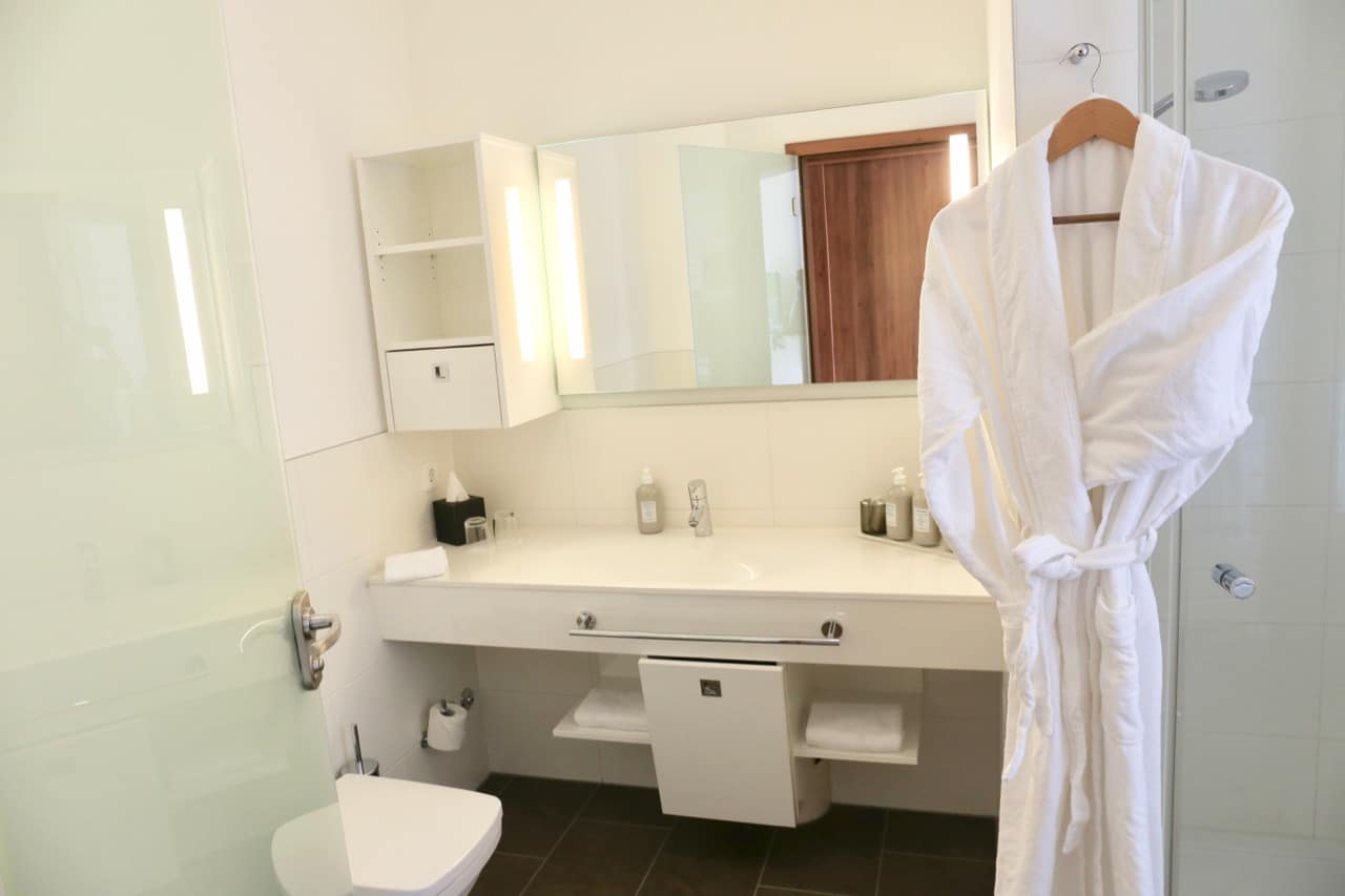 The Grand Ahrenshoop's bathrooms are bright white and include comfy bath robes.