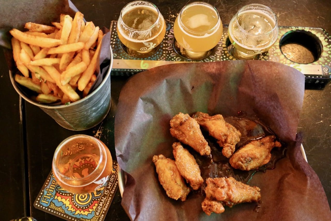 Chicken wings and hand-cut fries pair perfectly with a craft beer flight.