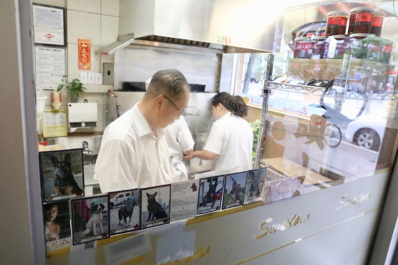 Those waiting for take out orders can peak into Swatow Toronto's Chinese restaurant kitchen.
