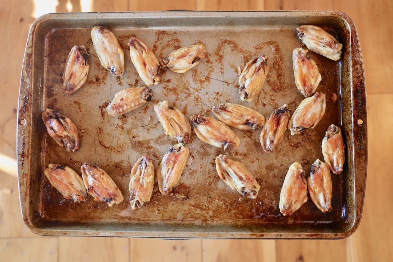 Gochujang chicken wings are baked twice, in oil then tossed in a sweet and spicy sauce.