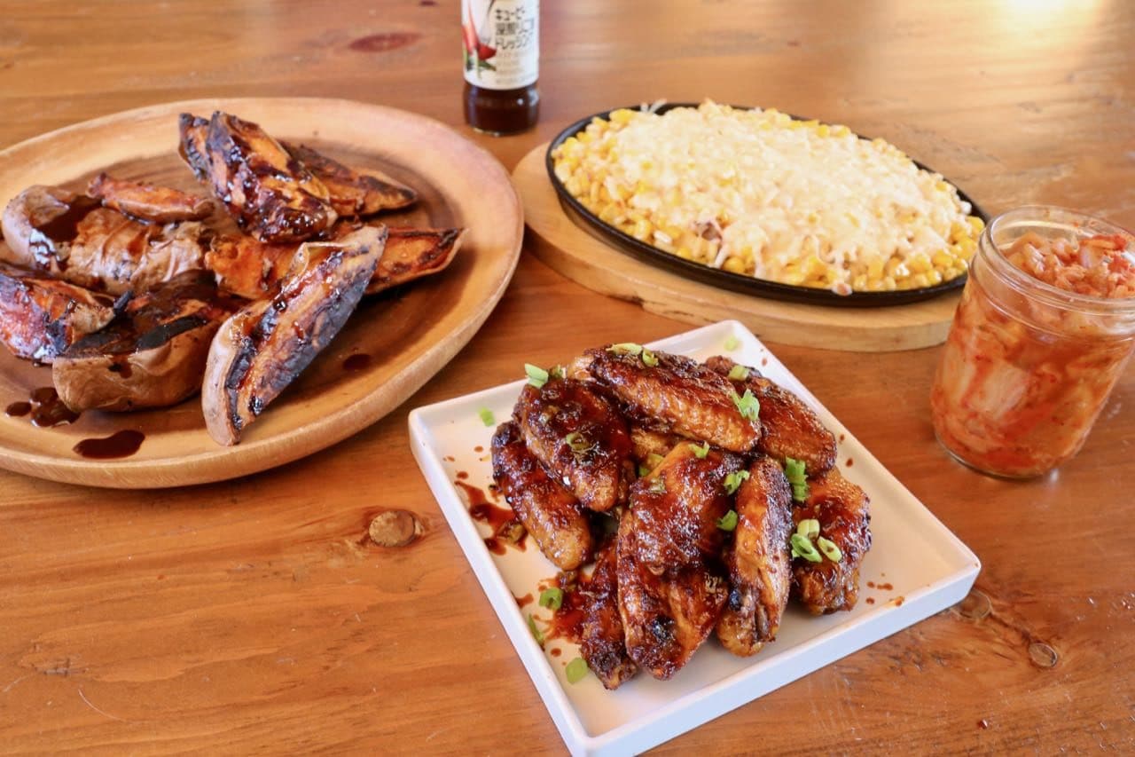 Gochujang chicken served with kimchi, sweet potatoes and corn gratin.