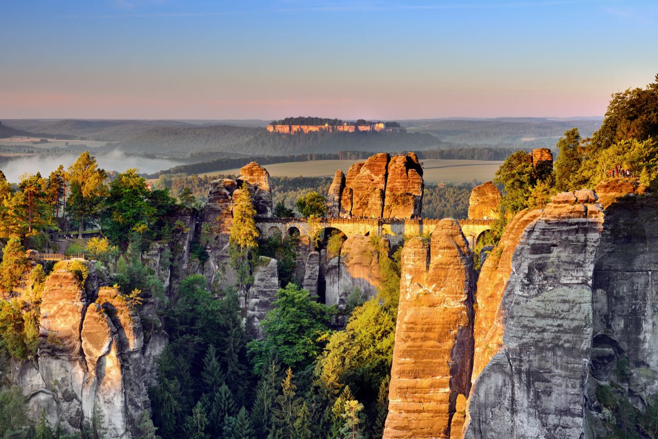 Enjoy a romantic hike at sunset at Saxon Switzerland National Park.