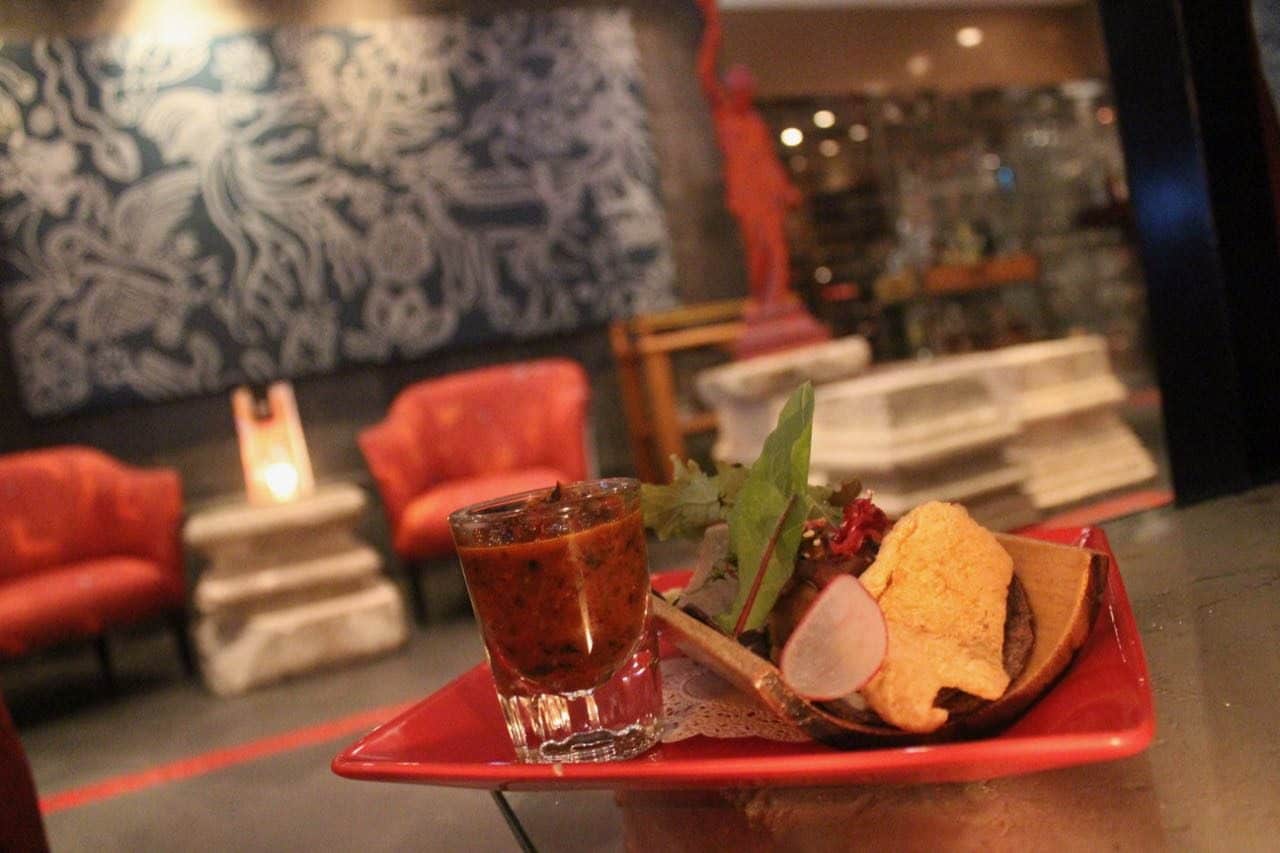 Enjoy decadent suckling pig confit tacos at the award-winning Cafe des Artistes.