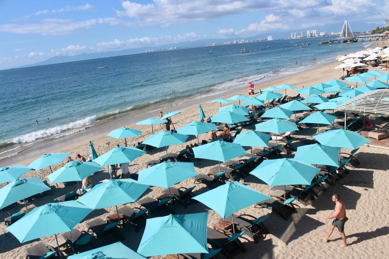Start your Puerto Vallarta gay bar hopping tour with a cocktail at sunset at Mantamar Beach Club.