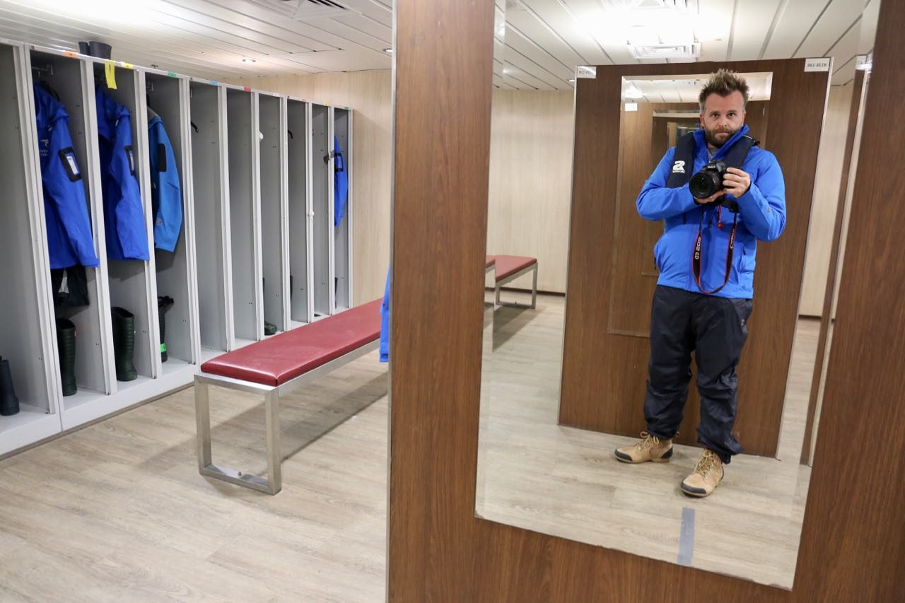 Guests get dressed in the mudroom before each days excursions on Adventure Canada's Newfoundland cruise.