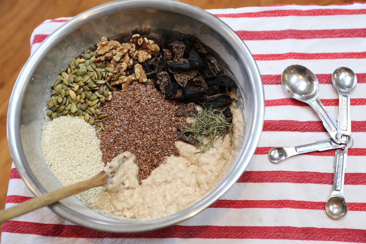 Mix healthy fibre crackers recipe ingredients in a mixing bowl.