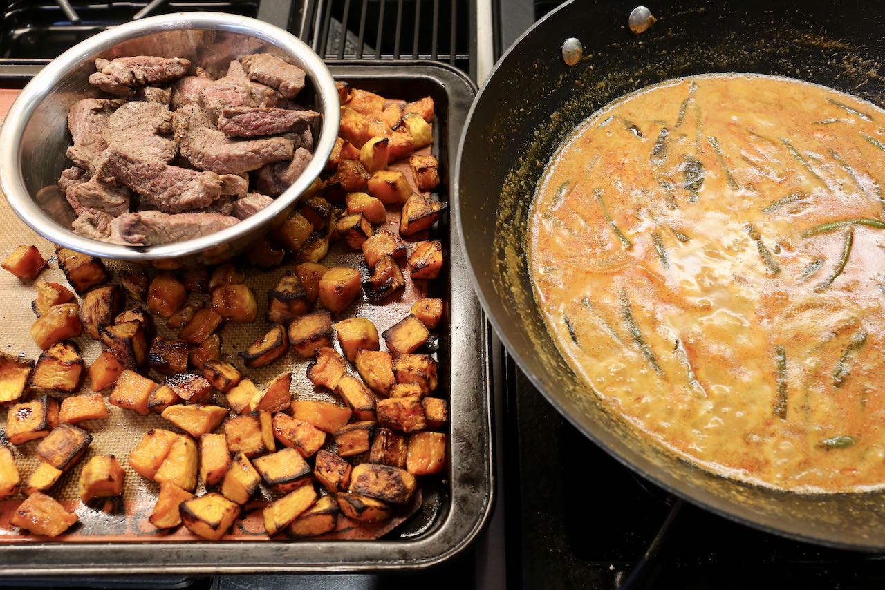 Add roasted pumpkin and sautéed beef to Thai red curry sauce.