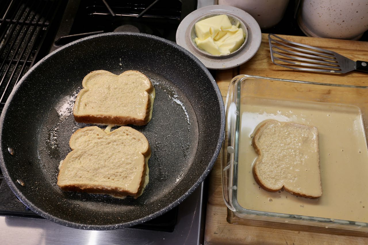 Fry French Toast in butter inside a non-stick frying pan.
