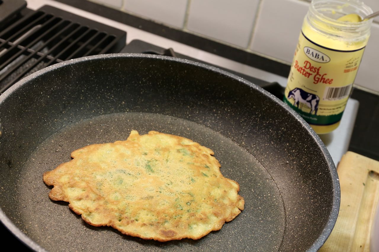 After flipping the perfect Pudla you should see a golden brown colour and crispy edges.