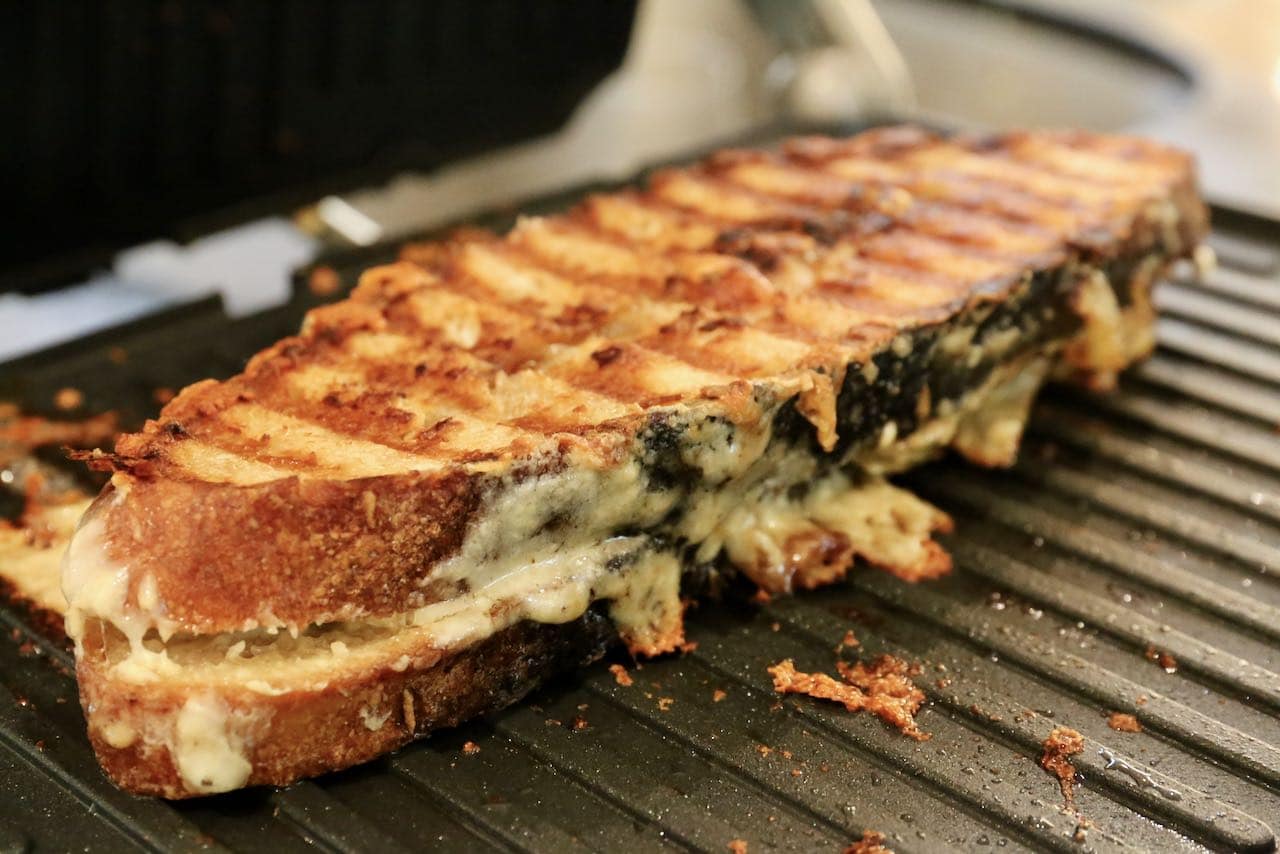Gruyere grilled cheese is finished cooking once golden brown and crispy.