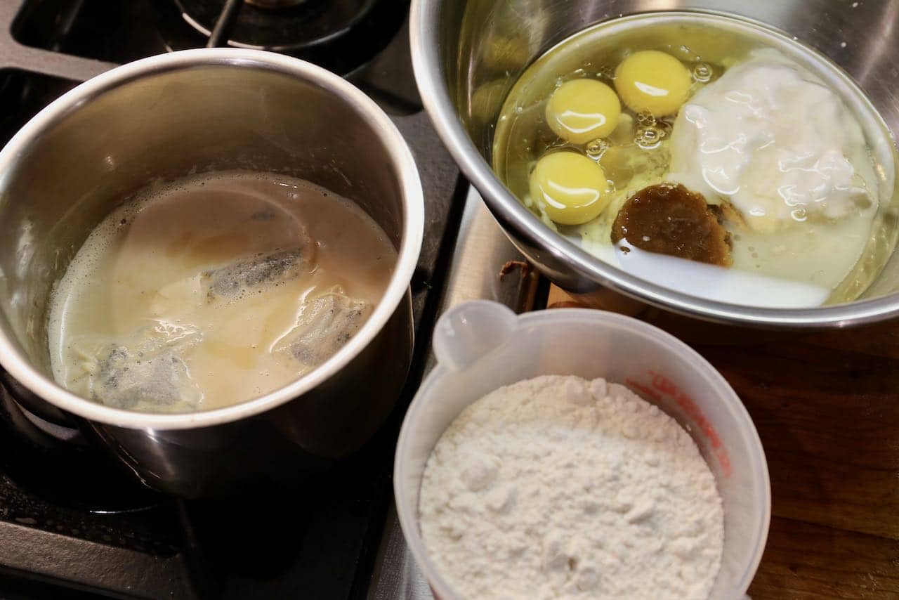 Simmer Earl Grey Tea bags in milk and mix wet ingredients in a large bowl.