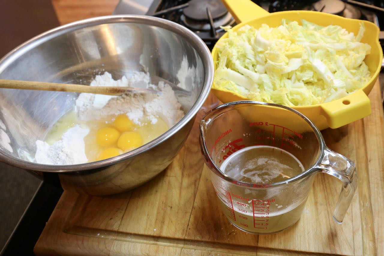 Osaka Okonomiyaki is prepared with flour, eggs, daishi and shredded cabbage.