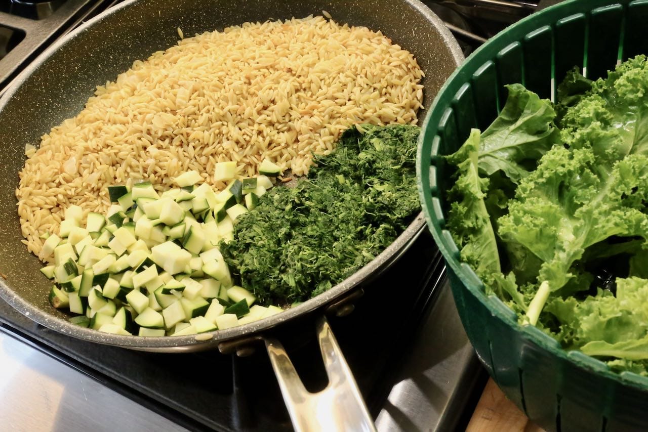 After frying orzo in onions sauté with zucchini, spinach and kale. 