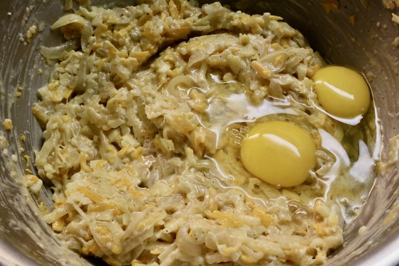 Add freshly cracked eggs and mix until the pie filling is fully combined. 