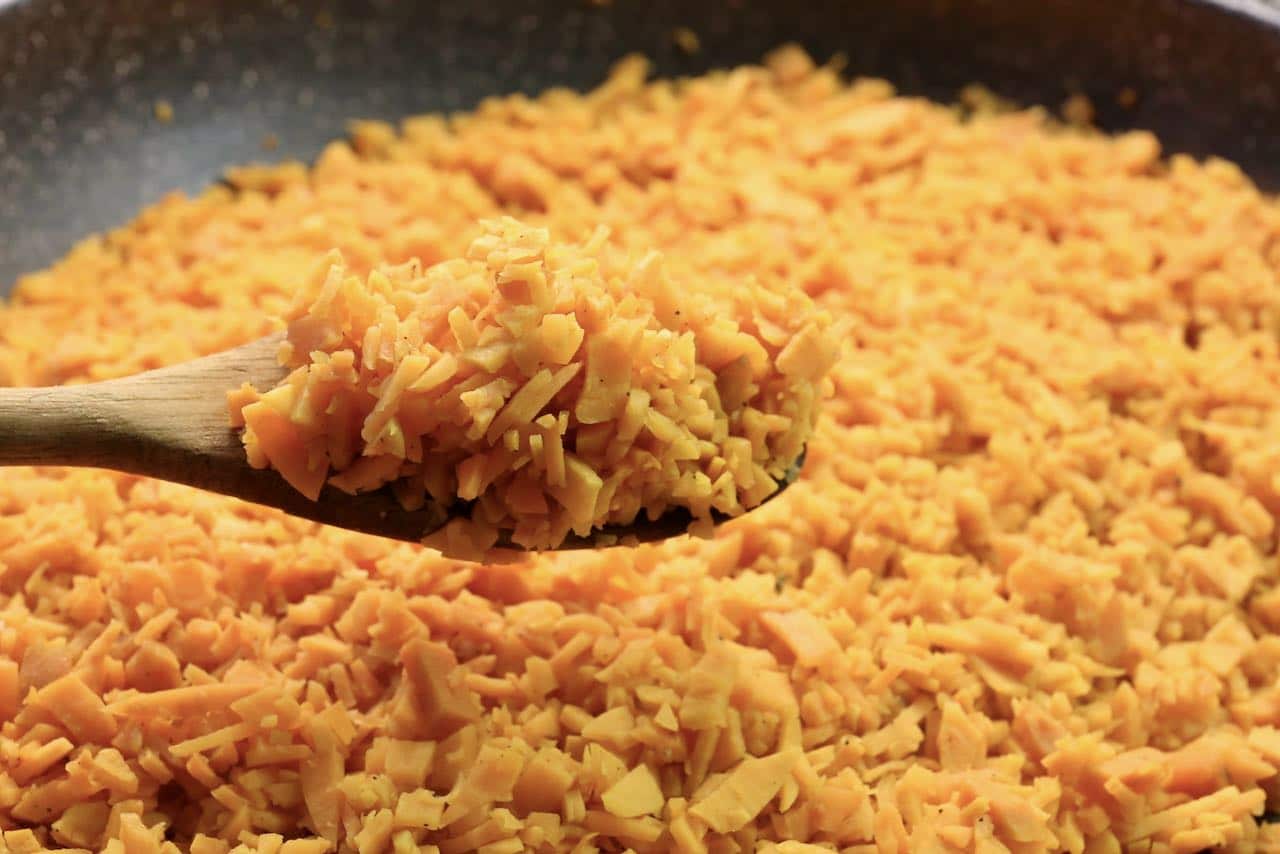 In a large non-stick pan sauté "rice" until it has browned.