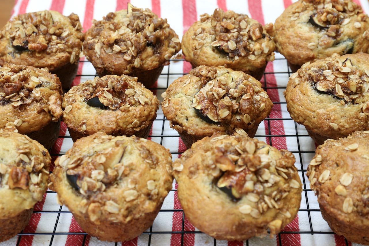 Cool fig muffins on a rack before serving.