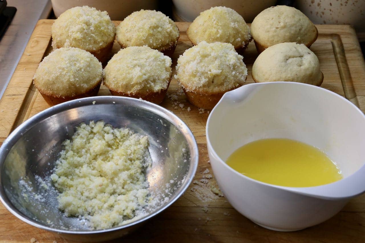 Dip Old Fashioned Donut Muffins in melted butter and toss in lemon zest sugar.