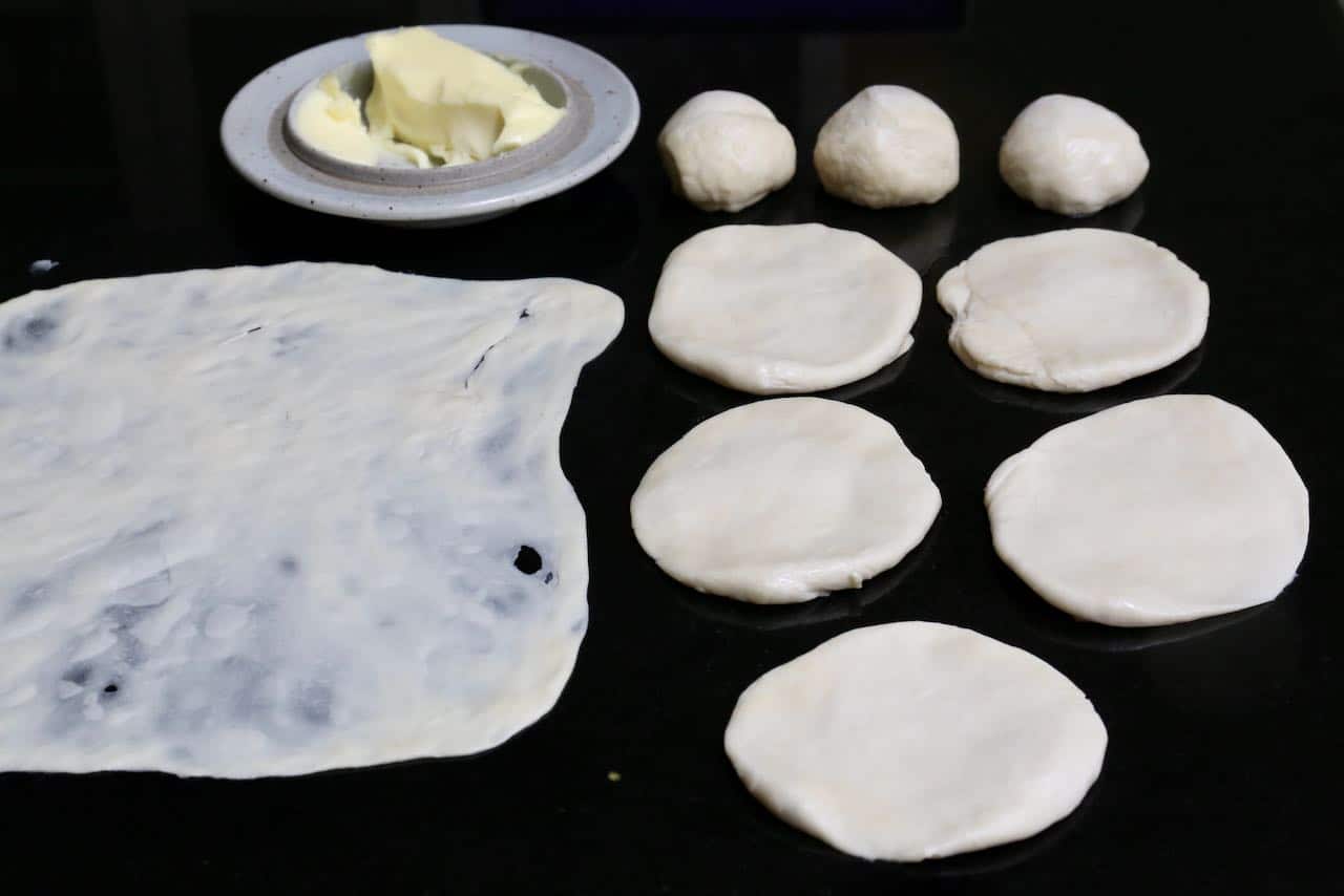 Use butter or oil to roll roti canai dough until very thin, almost see through. 