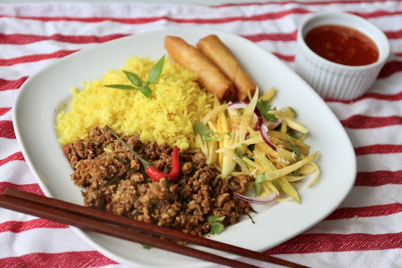 Khua Kling plate with rice, spring rolls and Thai mango salad.