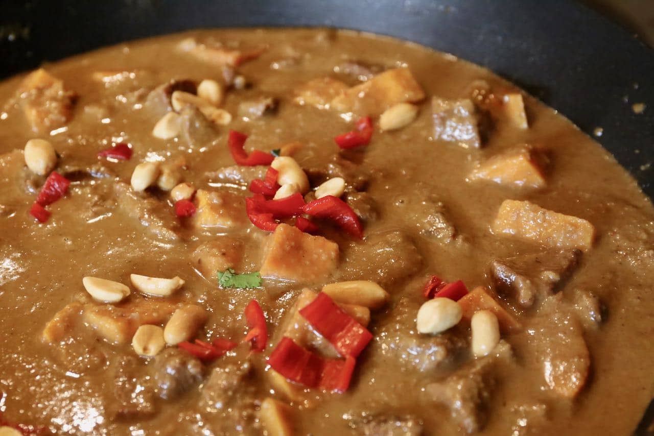 Add spicy Thai red chili and peanuts to  Gaeng Masaman beef and sweet potato stew.