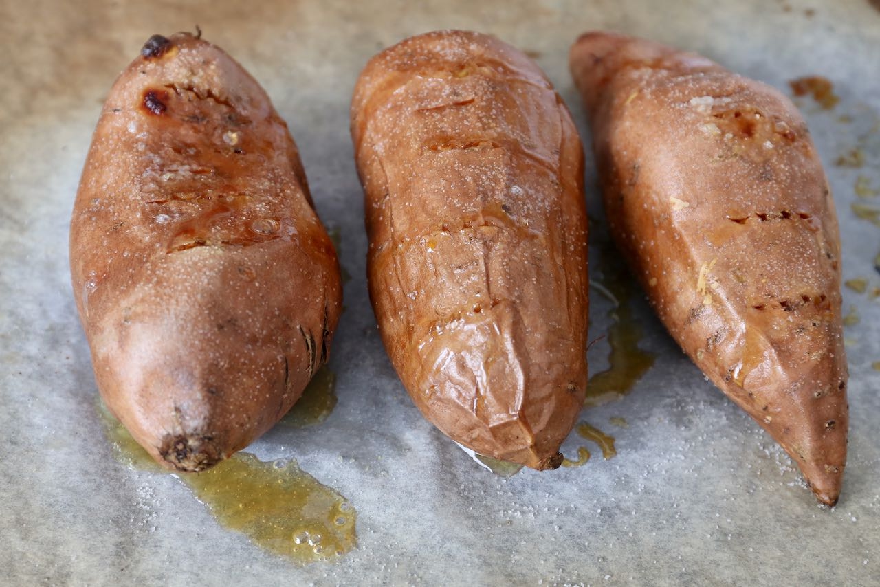 Bake Sweet Potatoes in the oven for 50 minutes until skin shrivels.