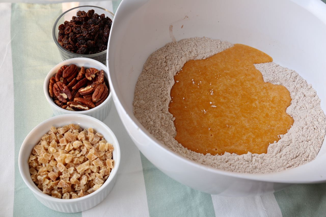 Pour sweet potato batter into dry ingredient well and mix with raisins. 
