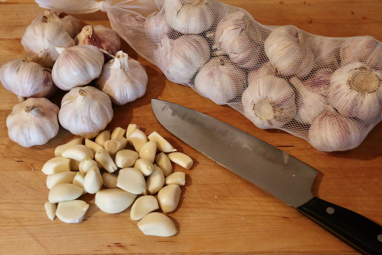 Peel garlic and remove the germ before adding to a food processor.