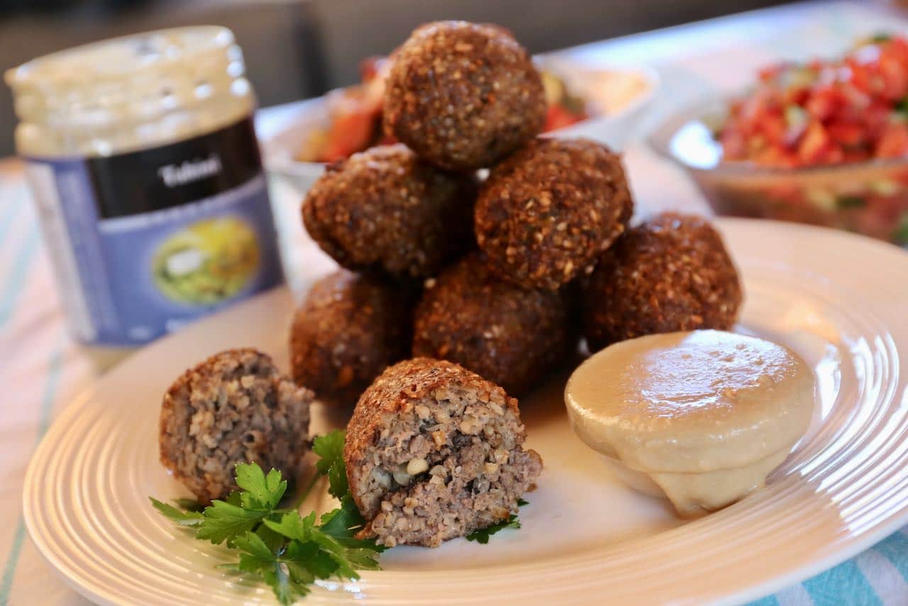 Slice fried kibbeh in half and you'll find a spiced pine nut interior.