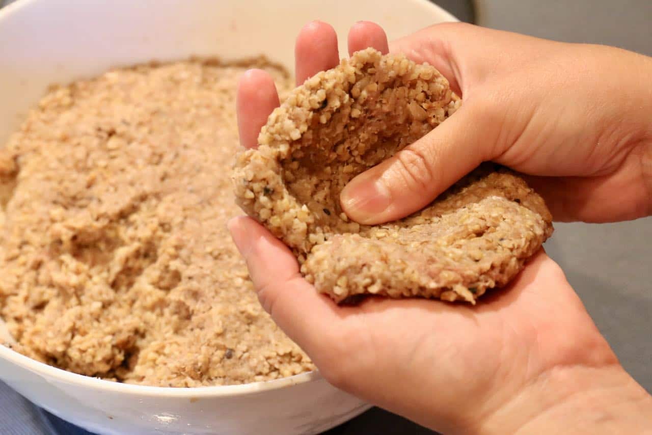 Use wet hands to shape fried kibbeh croquette casing.