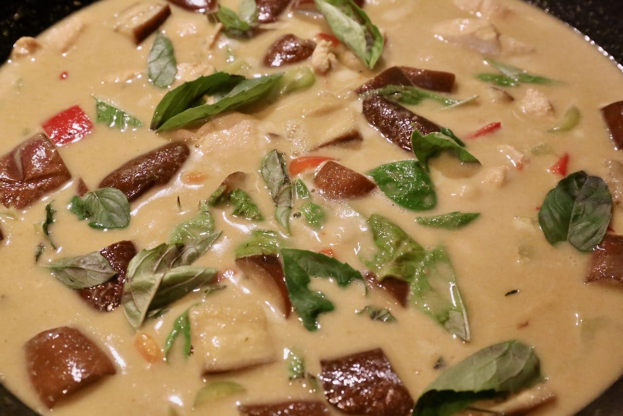 Simmer Gaeng Keow Wan with lime leaf, basil, eggplant and spicy chili.
