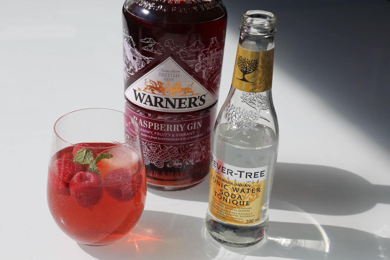 Pink Gin Cocktails: Mix tonic water with pink gin and raspberries.