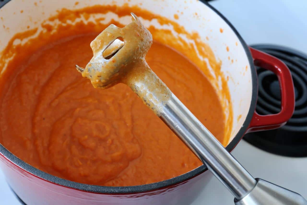Use an immersion blender to purée soup until smooth.