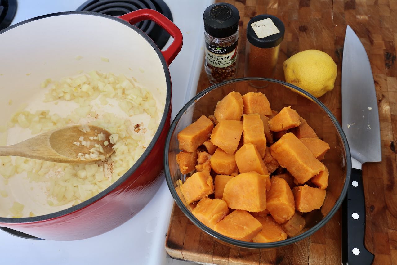 In a dutch oven sauté oil, garlic, onions and sweet potato.
