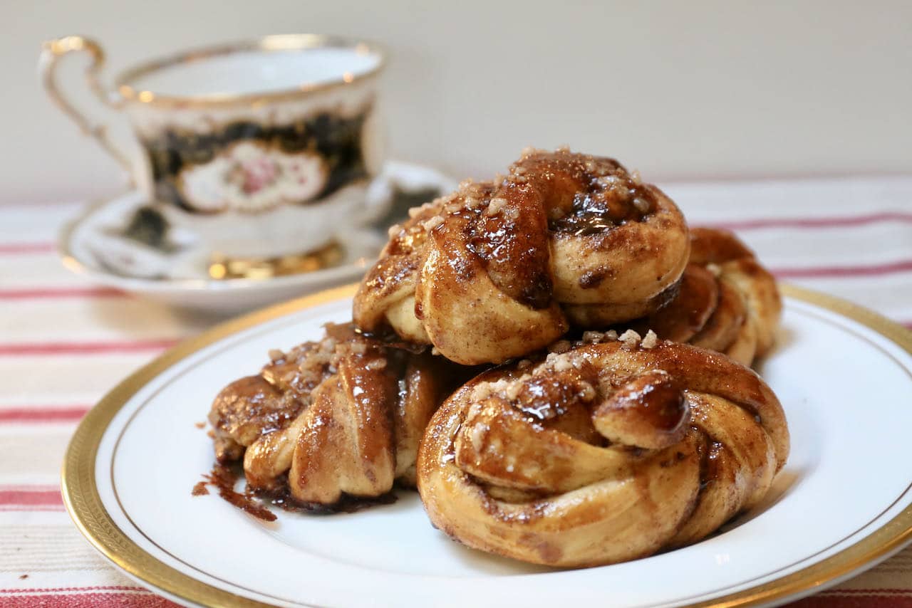 Serve warm Kardemummabullar with tea or coffee for a tasty fika!