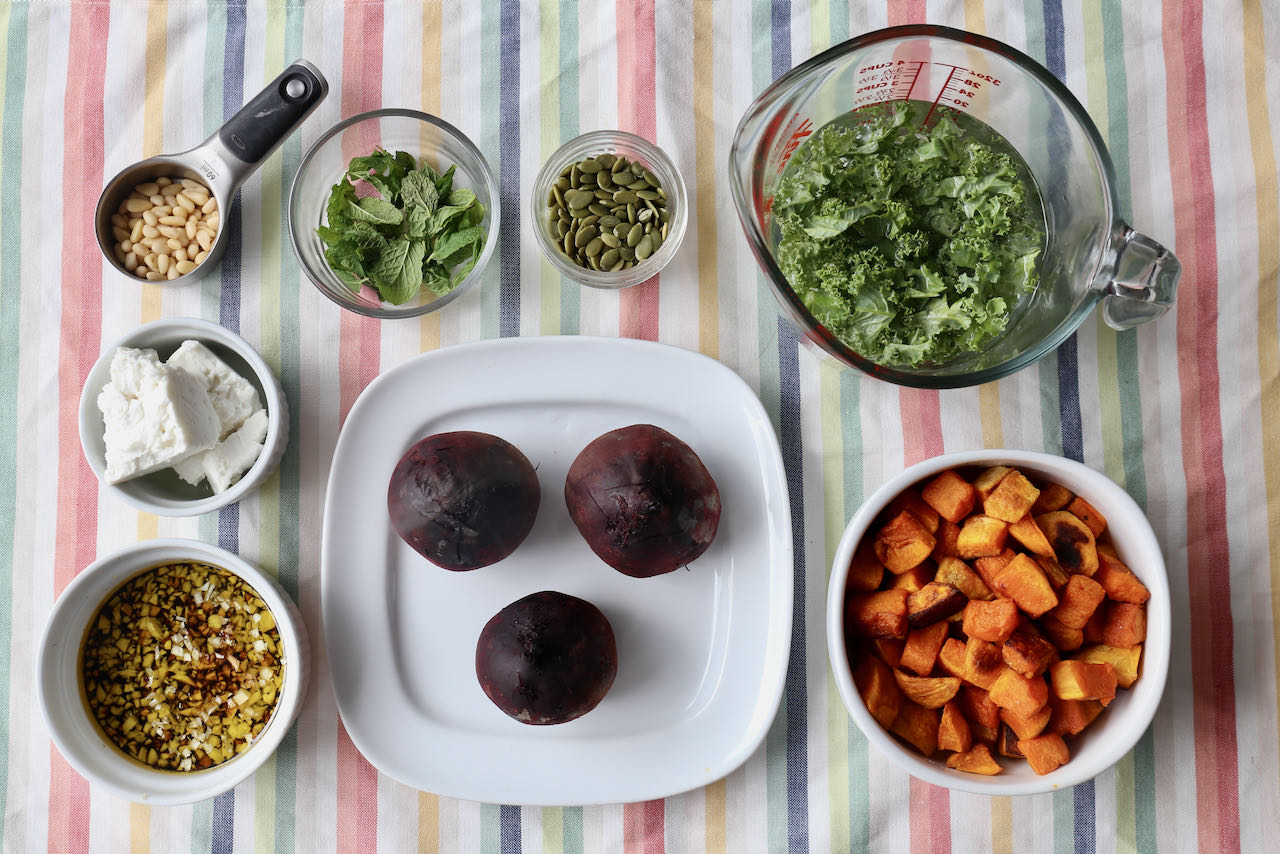 Before assembling your pumpkin and beetroot salad chop kale and whisk together the vinaigrette.