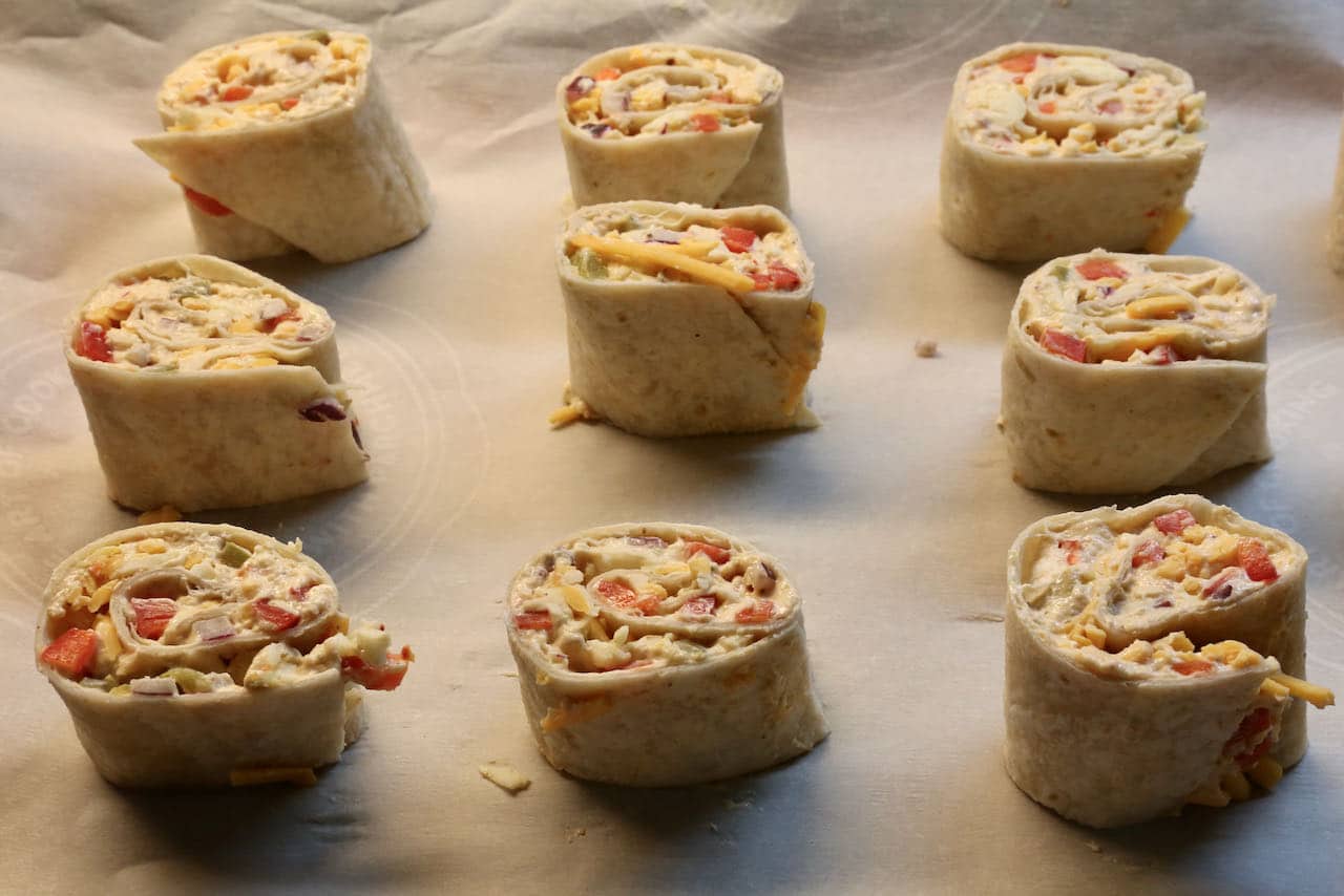 Slice Antojito's into 1-inch pieces and place on baking sheet.